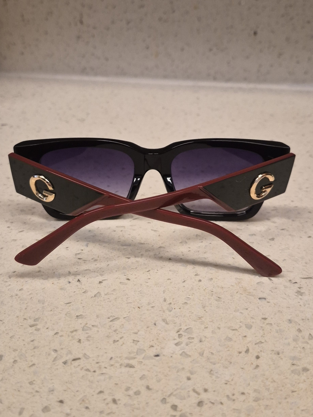 Stylish Black Frame Sunglasses with Red Temples